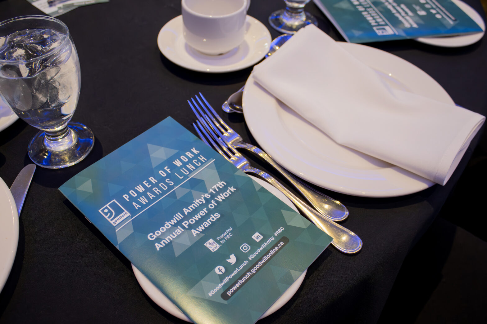 A photo of the 2023 Power of Work Awards lunch program on the set gala table